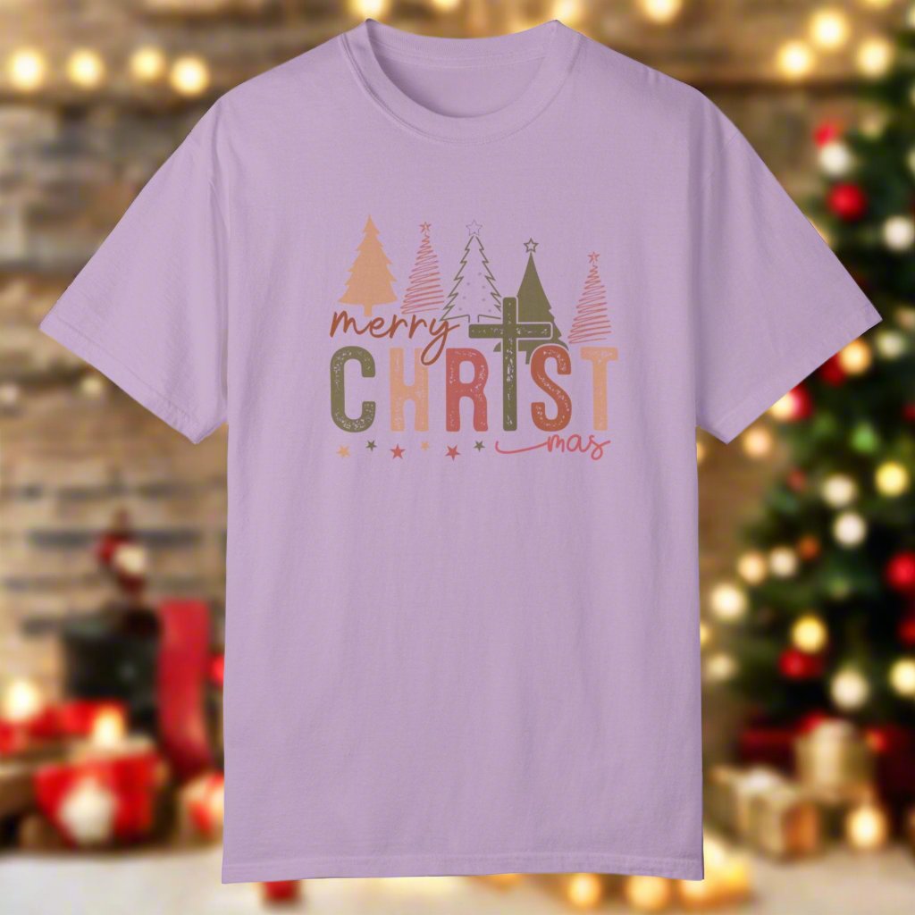 The christmas cross shirt in orchid with a cross as the T and christmas trees in the background