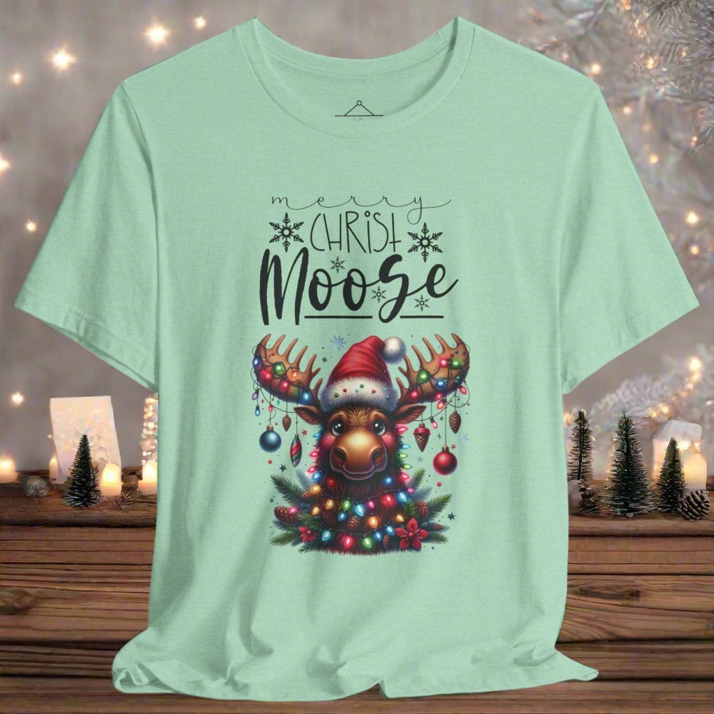 The Merry Christ-Moose Tshirt in heather mint featuring a moose decorated with ornaments and lights