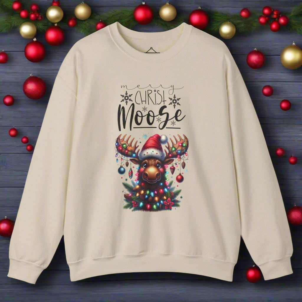 Merry Christ-Moose Christmas Sweatshirt in sand featuring a moose decorated with christmas ornaments and lights 