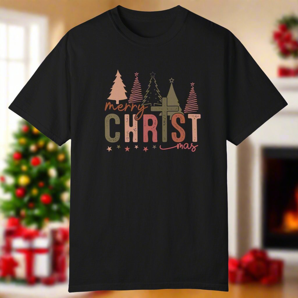 The christmas cross shirt in black with a cross as the T and christmas trees in the background