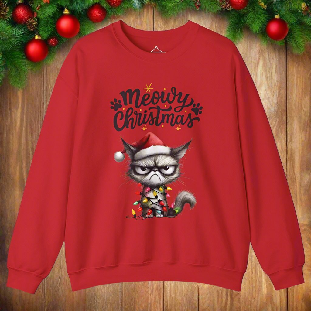 Grumpy Meowy Christmas Sweatshirt  in red with the words Meowy Christmas and a grumpy cat with a red hat and wrapped up in lights