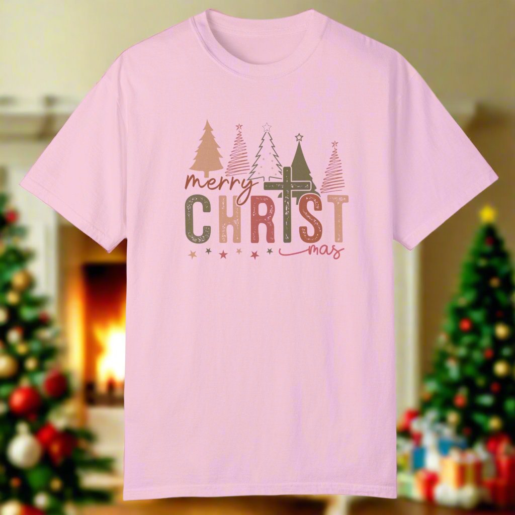 The christmas cross shirt in blossom with a cross as the T and christmas trees in the background