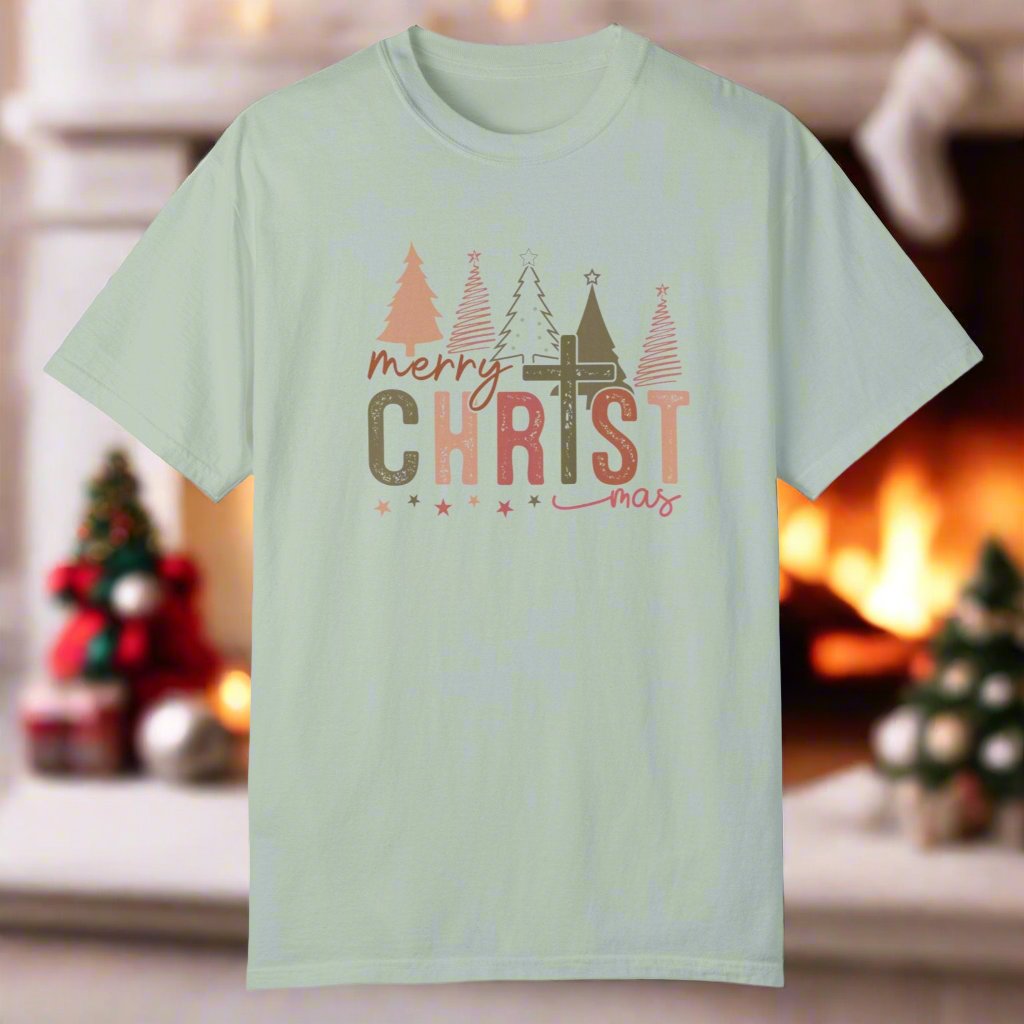 The christmas cross shirt in bay with a cross as the T and christmas trees in the background