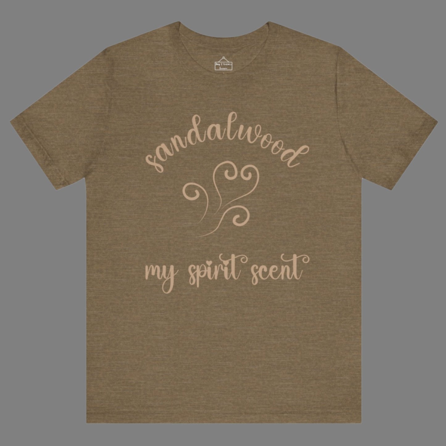 The My Spirit Scent is Sandalwood t-shirt in heather olive featuring script font and an aroma script heart in a warm, muted beige hue