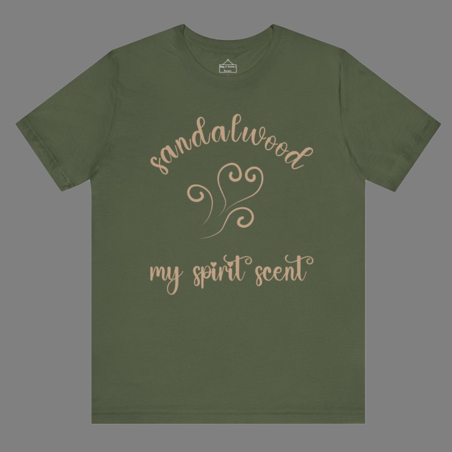 The My Spirit Scent is Sandalwood t-shirt in military green featuring script font and an aroma script heart in a warm, muted beige hue