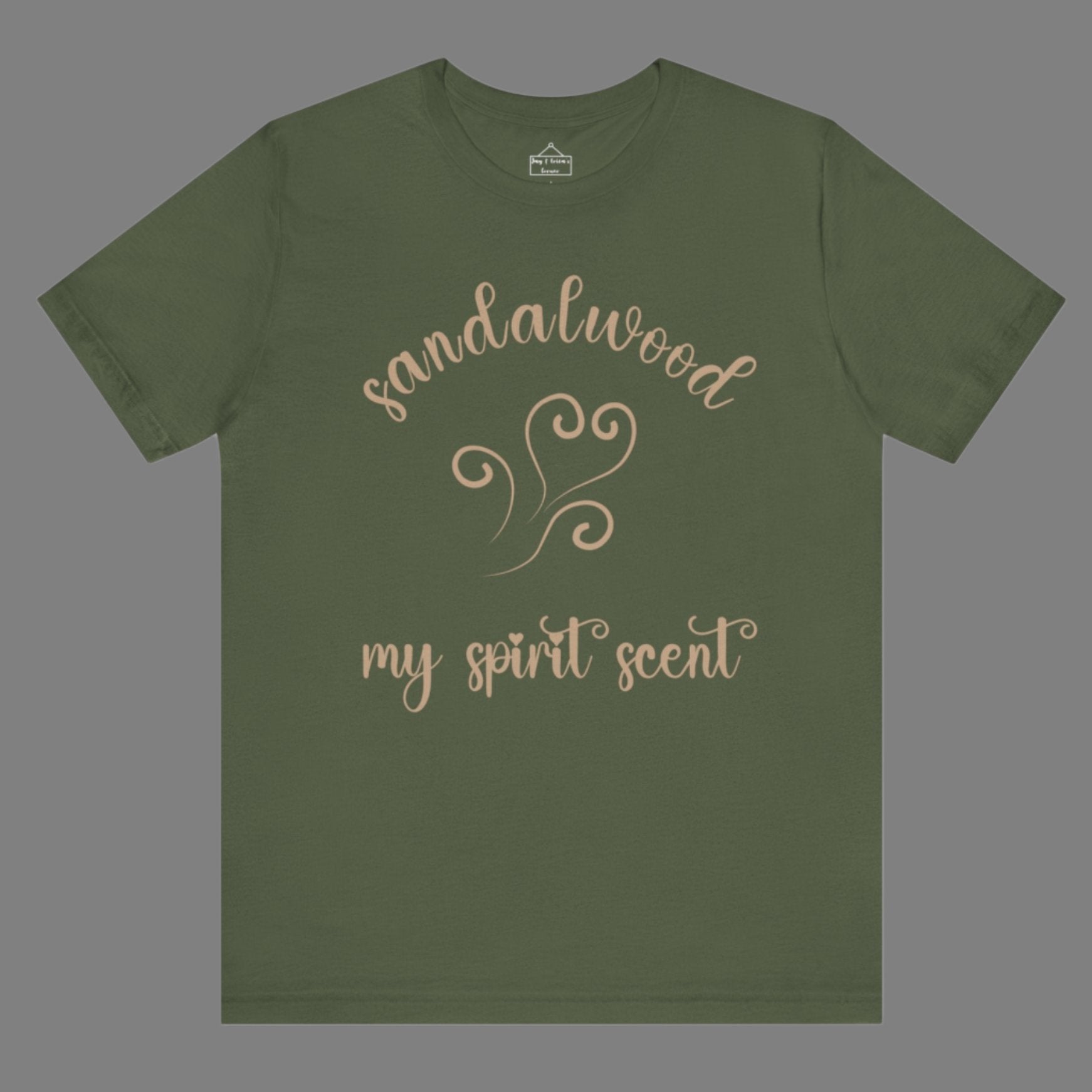 The My Spirit Scent is Sandalwood t-shirt in military green featuring script font and an aroma script heart in a warm, muted beige hue