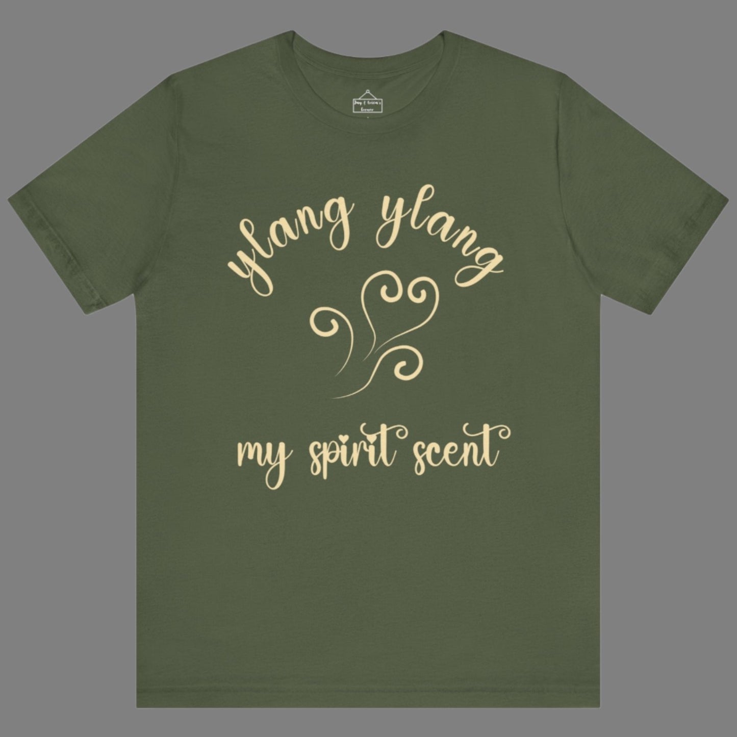 The My Spirit Scent is Ylang Ylang t-shirt in military green featuring script font and an aroma script heart in a soft, pastel yellow hue