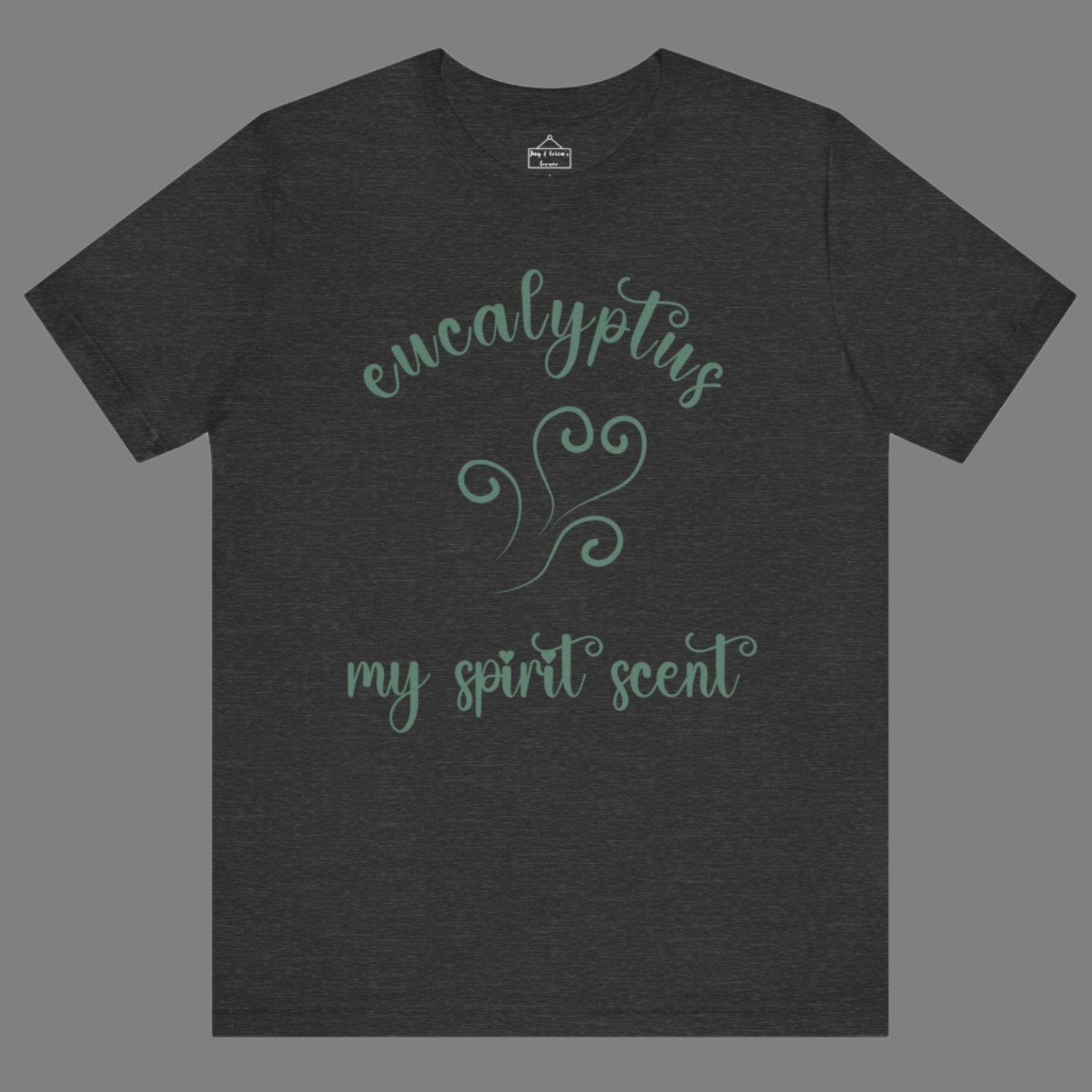 The My Spirit Scent is Eucalyptus t-shirt in dark grey heather featuring script font and an aroma script heart in a blue-green hue