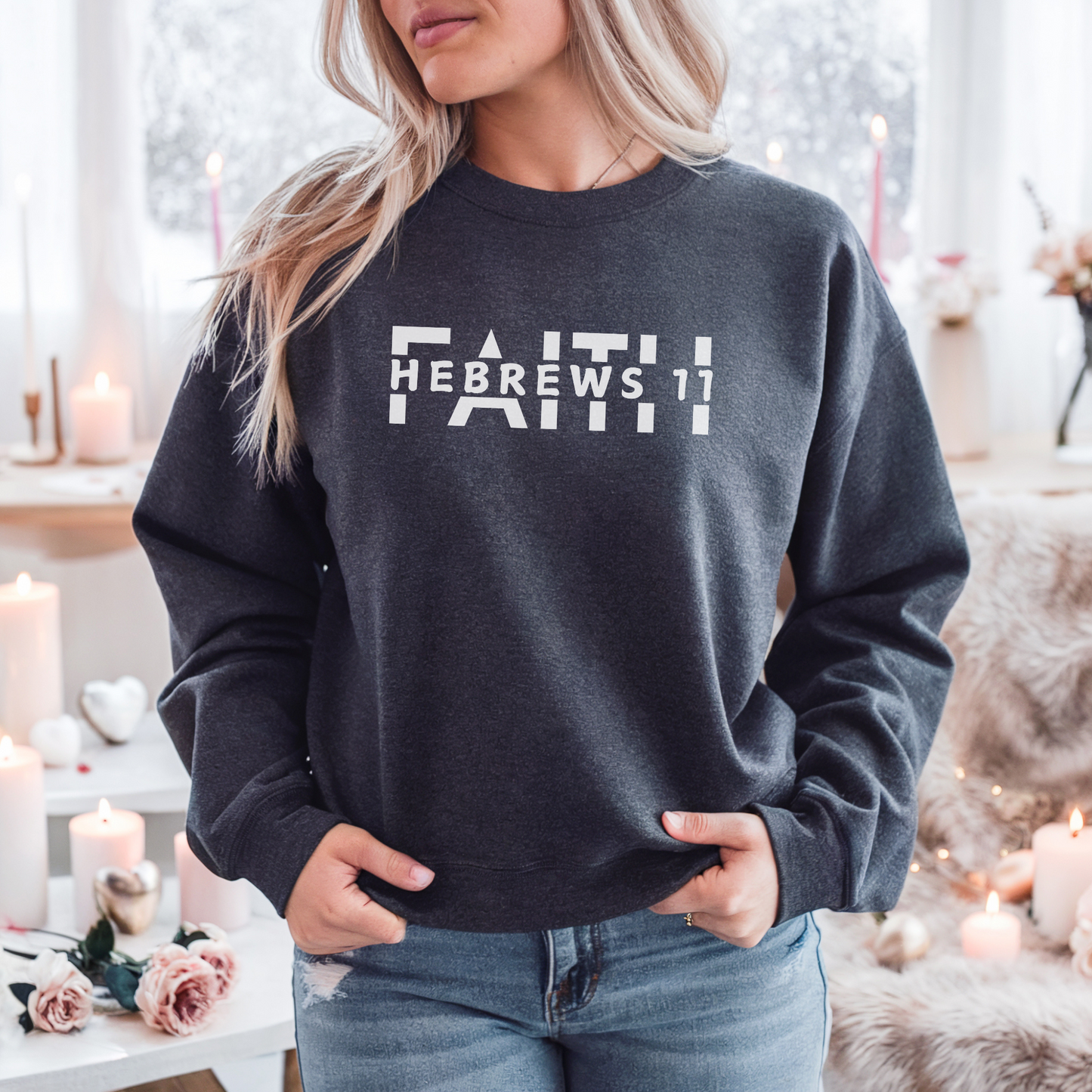 A smiling woman wearing the FAITH Hebrews 11 sweatshirt in dark grey featuring the word faith with Hebrews 11 cut between the letters all in white print