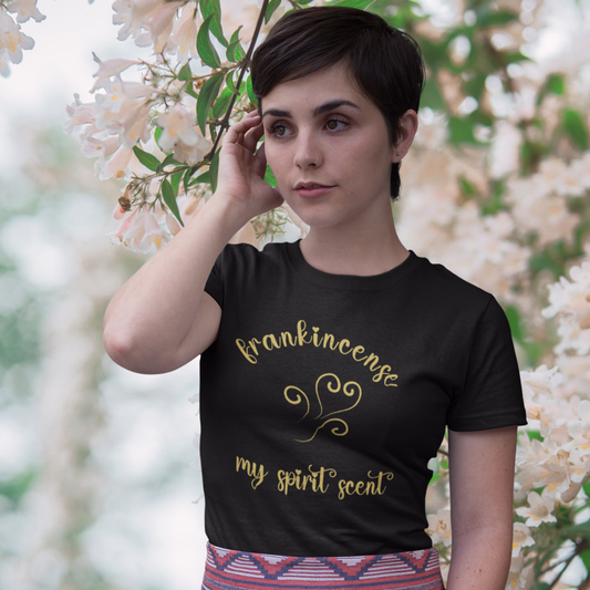 The My Spirit Scent is Frankincense t-shirt in black heather featuring script font and an aroma script heart in a warm, golden brown hue